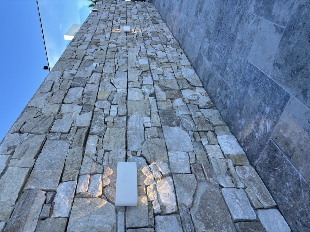 Stone feature wall lighting installed on the Gold Coast by Sparkez Electrical